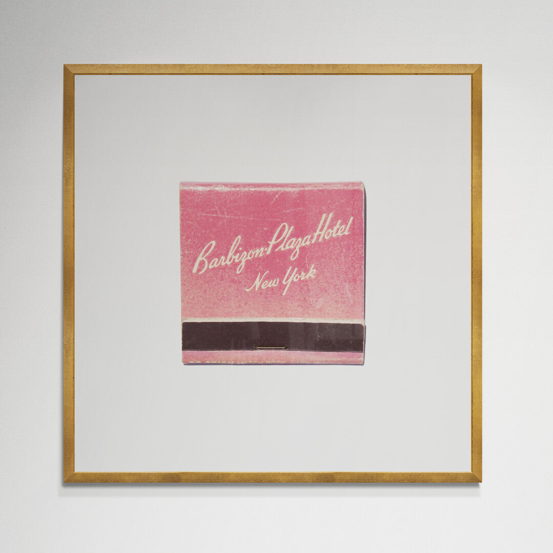 Barbizon Plaza matchbook print in gold frame on wall