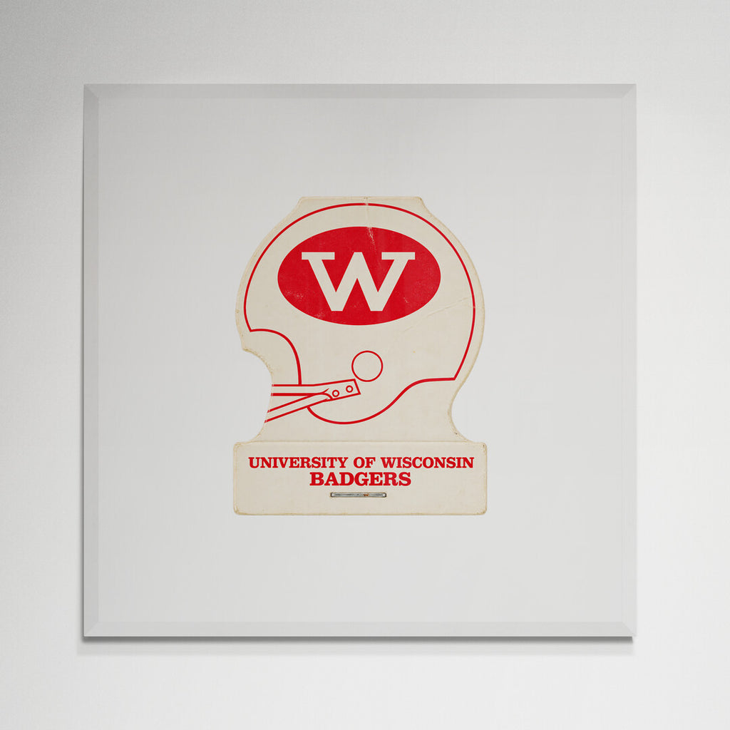 Wisconsin football helmet print in white frame on wall
