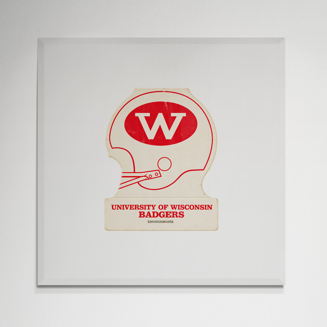 Wisconsin football helmet print in white frame on wall