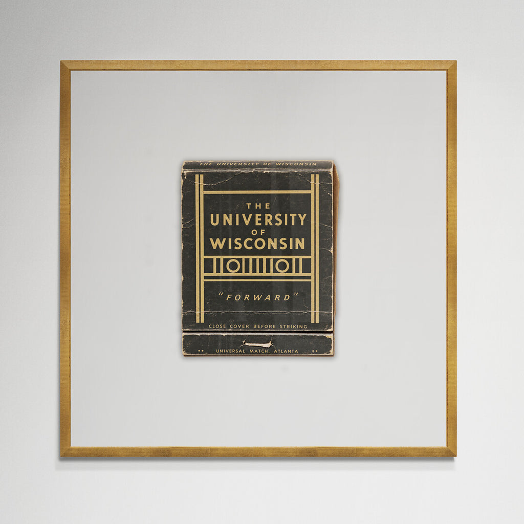 UW Forward matchbook print in gold frame hanging on wall