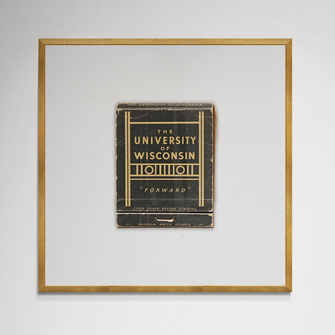 UW Forward matchbook print in gold frame hanging on wall