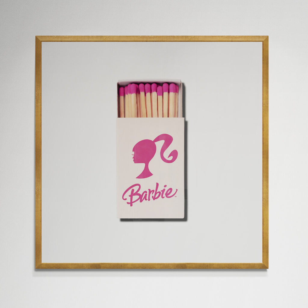 Barbie matchbox print in white frame on wall